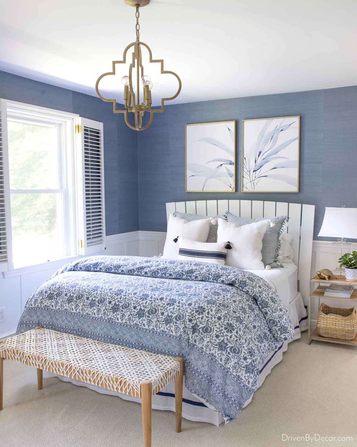 Blue grasscloth wallpaper installation in a bedroom
