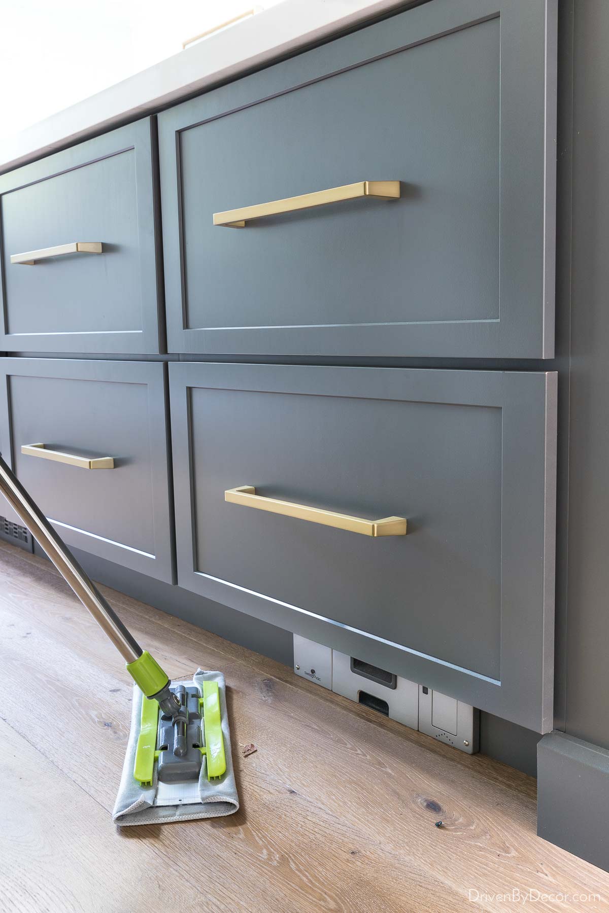 Vacuum built into kitchen island toekick