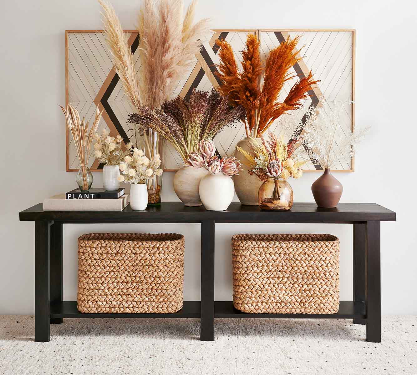 Narrow baskets under a console table