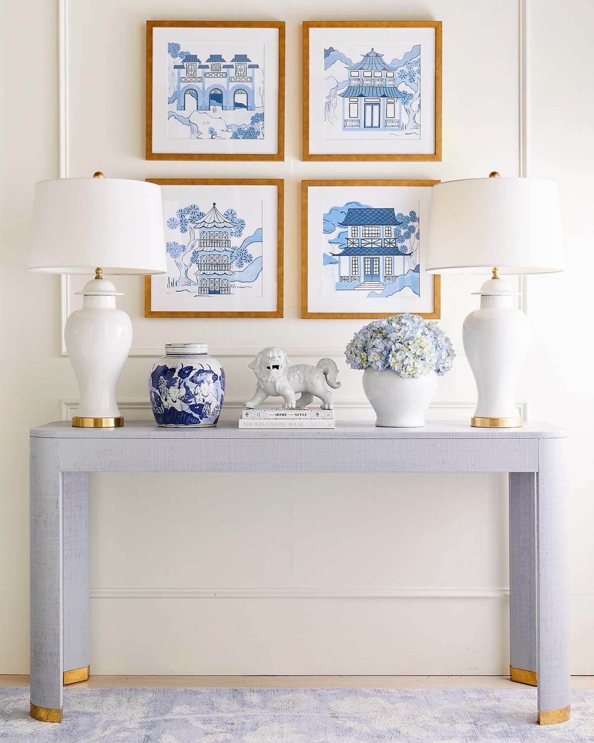 A pair of white temple jar lamps as console table decor