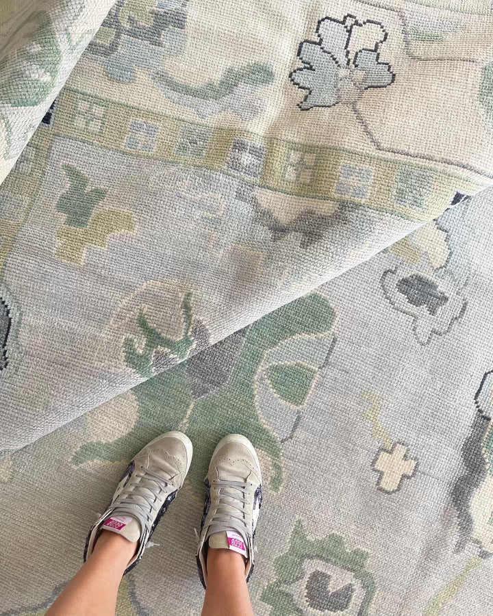 Oushak rug with blues, greens, & creams