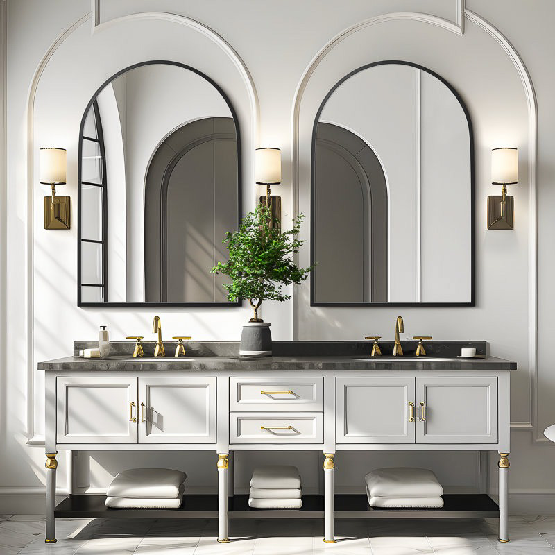 Black arched mirrors over sinks in bathroom