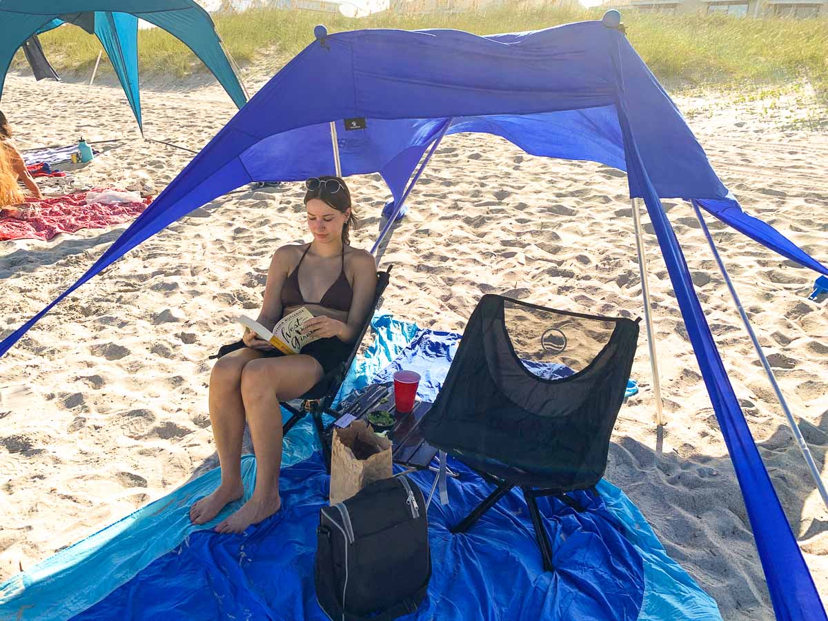 Portable beach tent and chairs with sand-free beach blanket