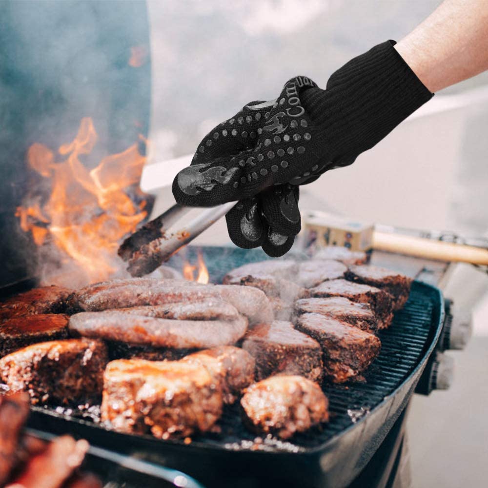 Grilling gloves protecting hands while using a hot grill