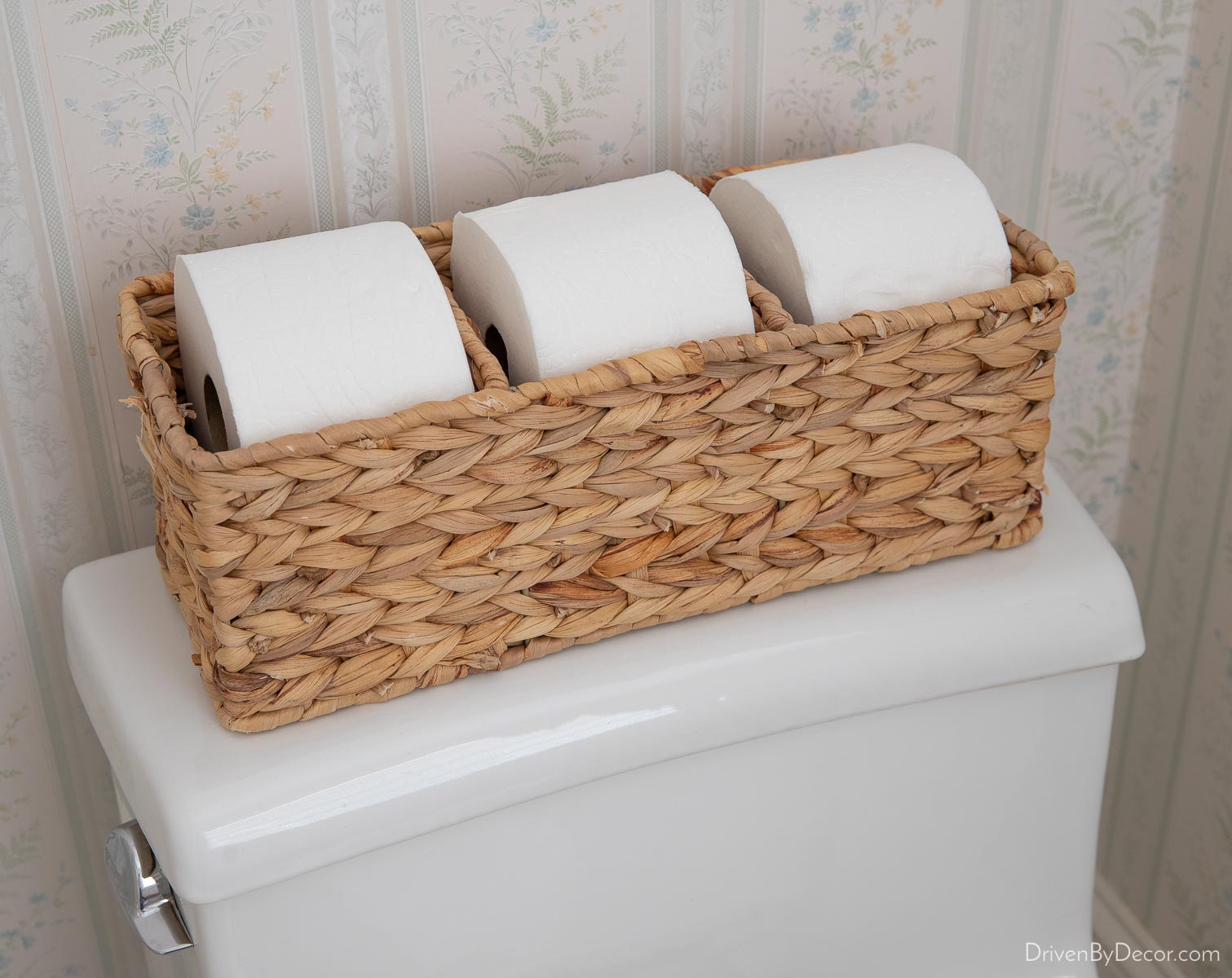 Guest Bedroom Ideas For Creating a Welcoming Retreat! Toilet tank basket holding rolls of toilet paper