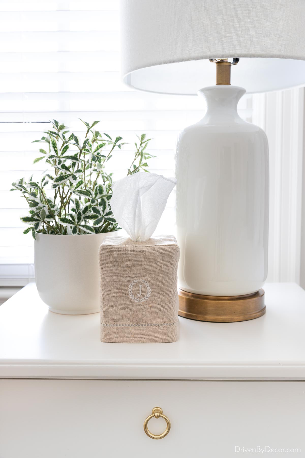 Tissue box with linen cover on nightstand