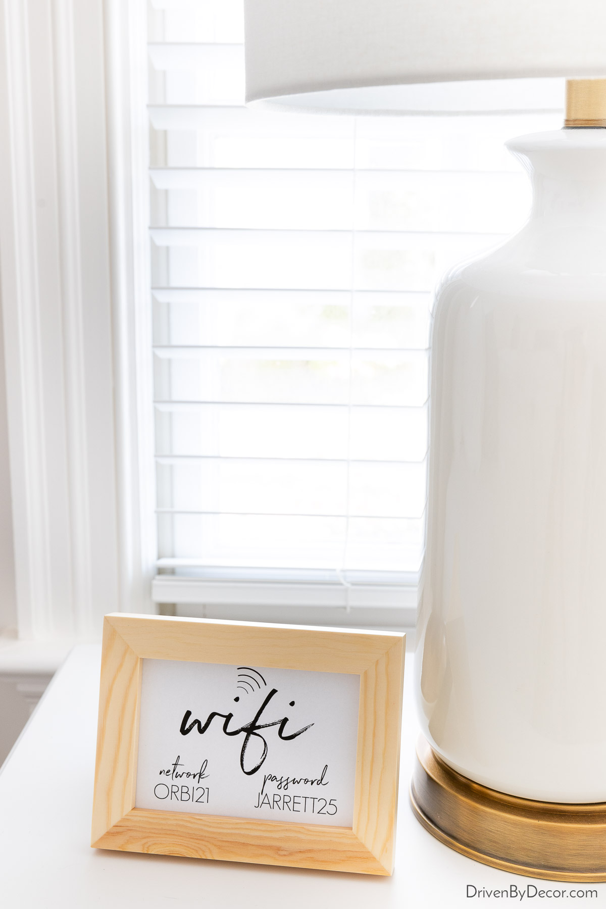 Guest bedroom wifi code framed on nightstand
