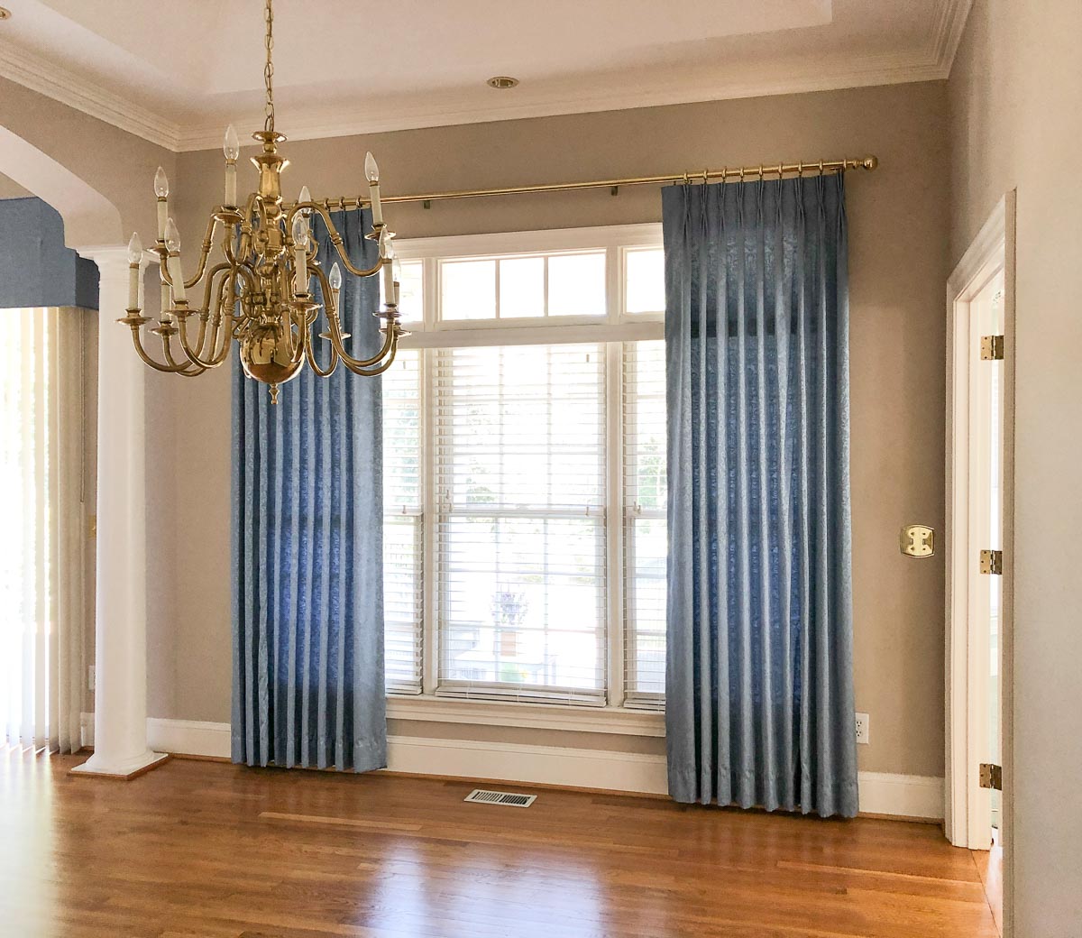 Drapes hung too low and not wide enough on window