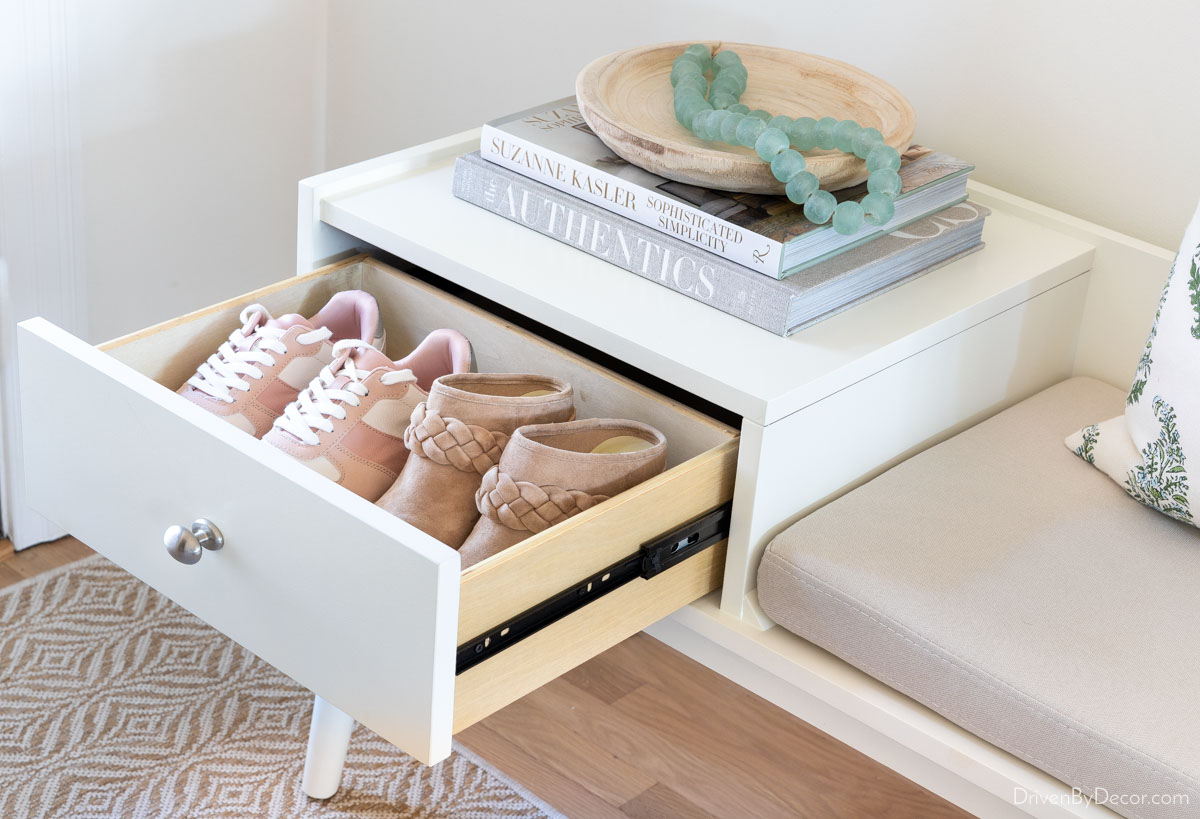 Drawer storing two pairs of shoes in entryway