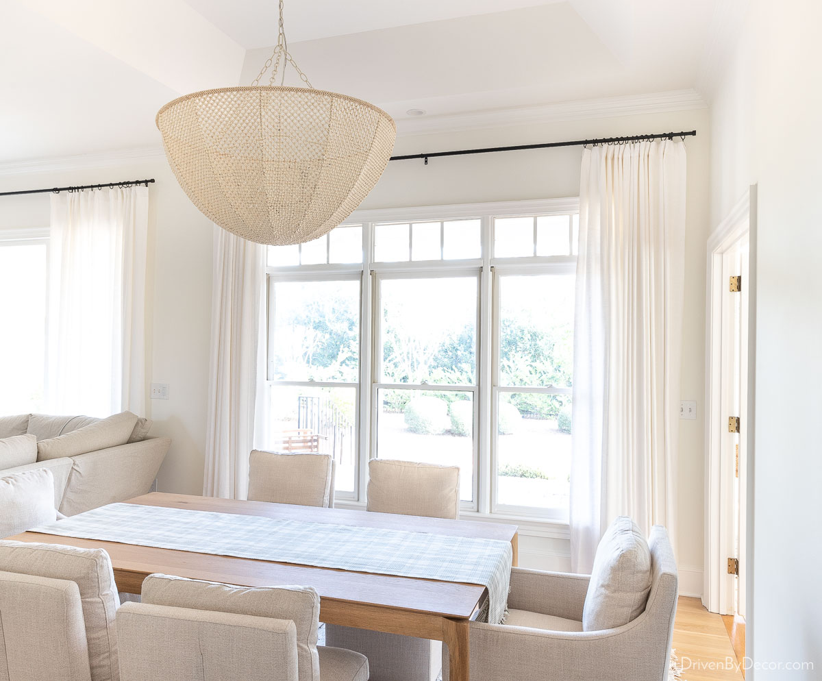 White curtains hung high and wide as and example of how high to hang curtains