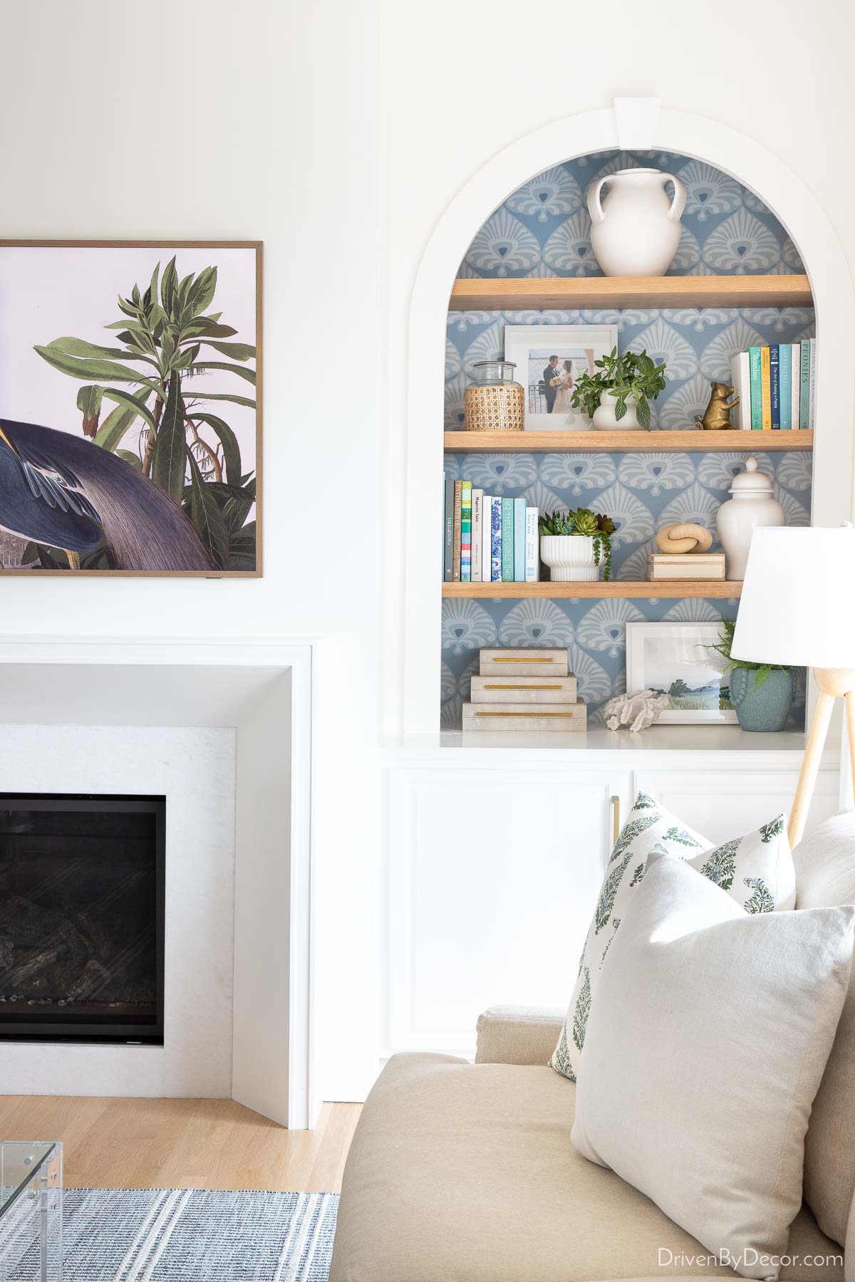 Fireplace above TV and remodeled shelves in living room