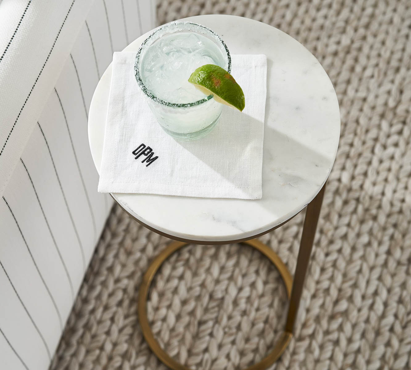 Martini table with drink and napkin on top