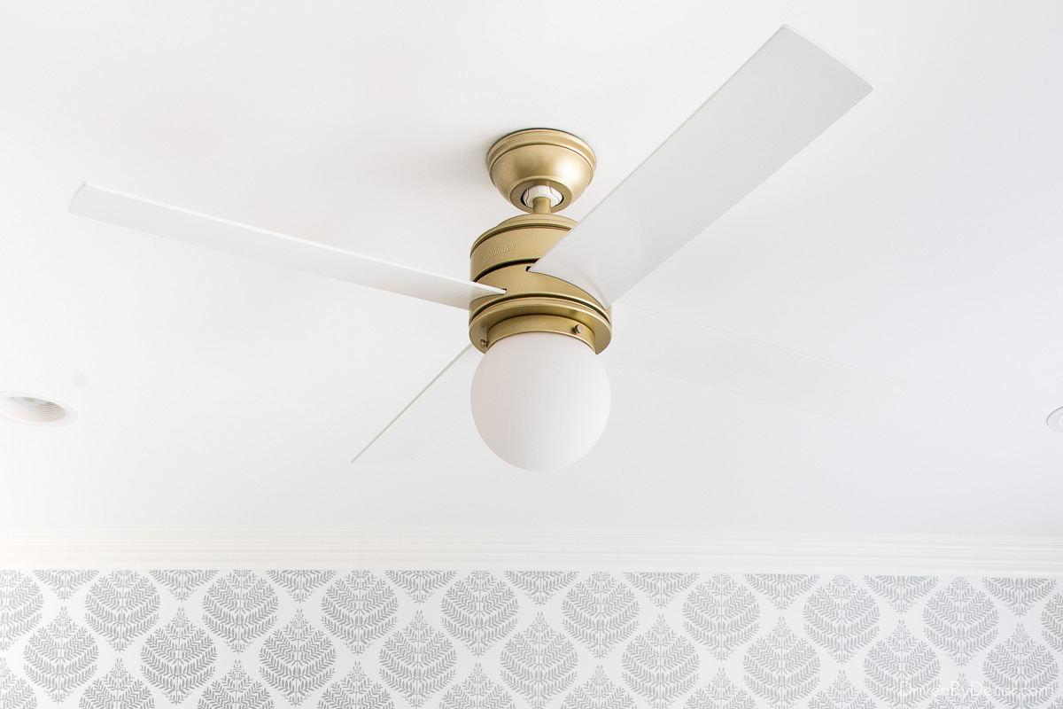 Favorite ceiling fan with brass base and white blades