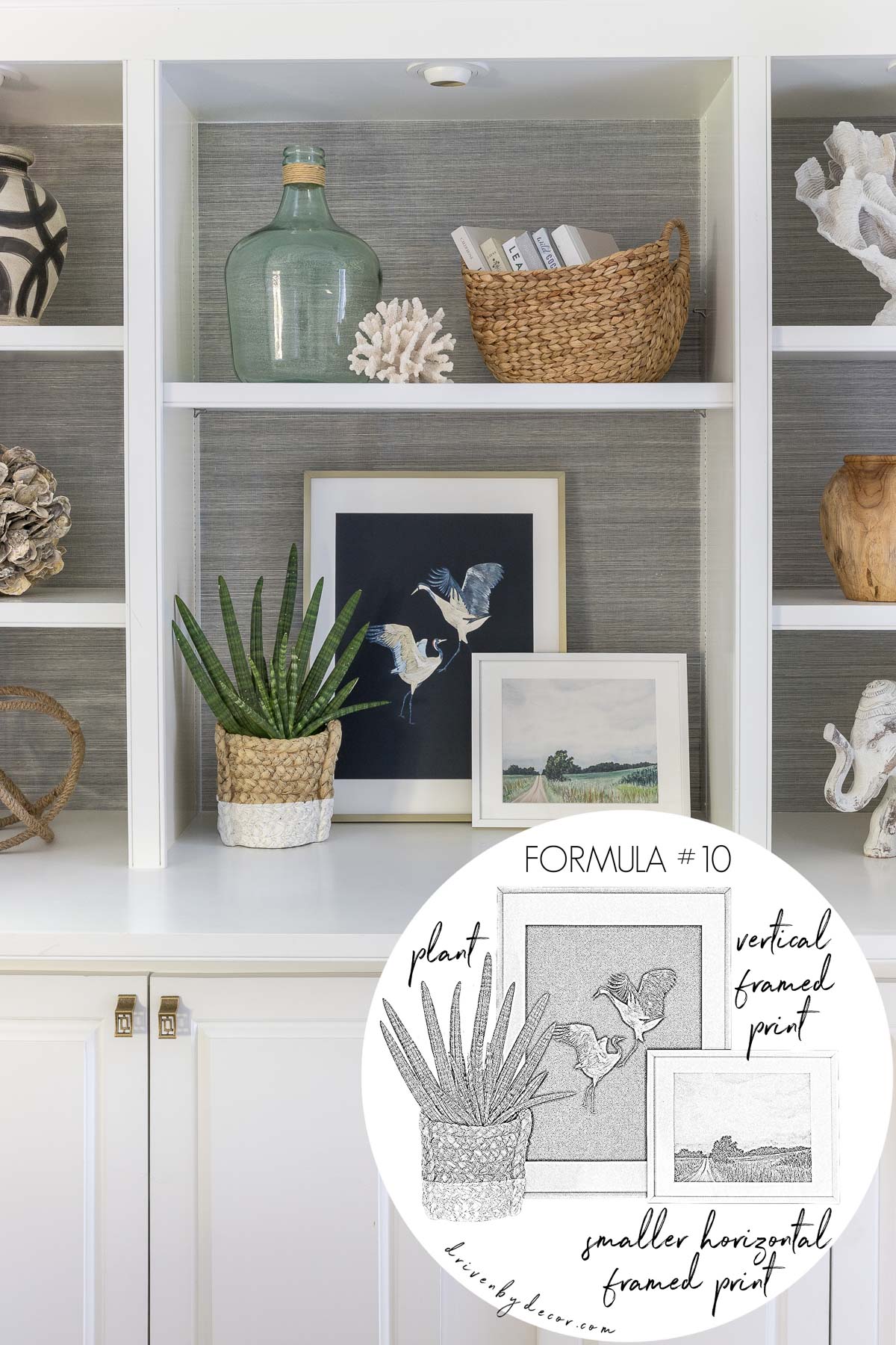 Layered framed art prints plus a plant grouped together to decorate a bookshelf