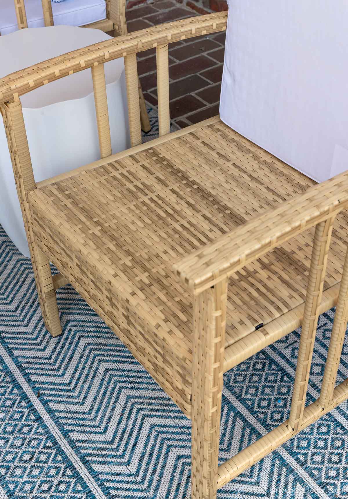Woven chair seats under cushion of back porch chairs