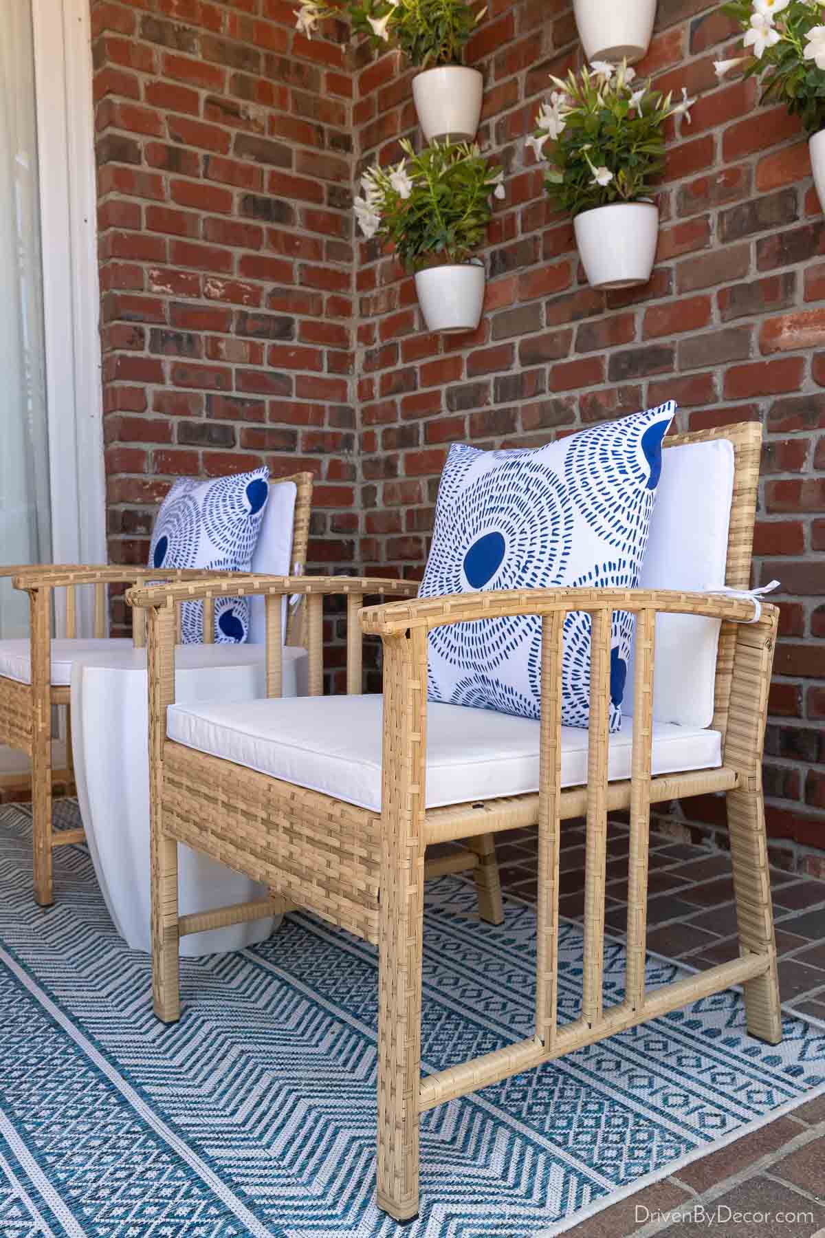 Pair of woven patio chairs on back porch
