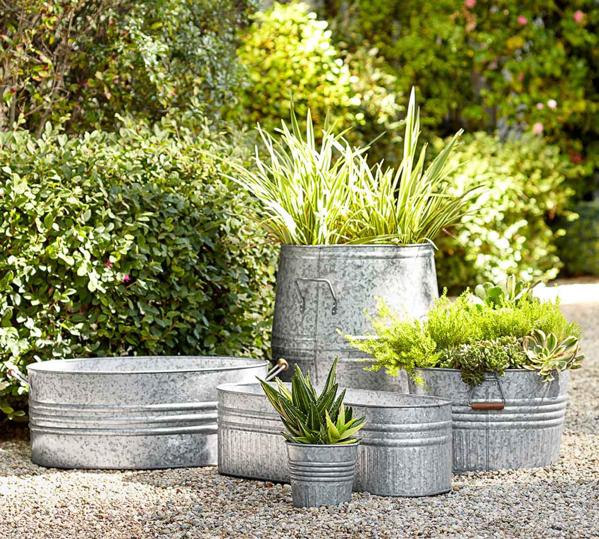 A variety of galvanized metal planters