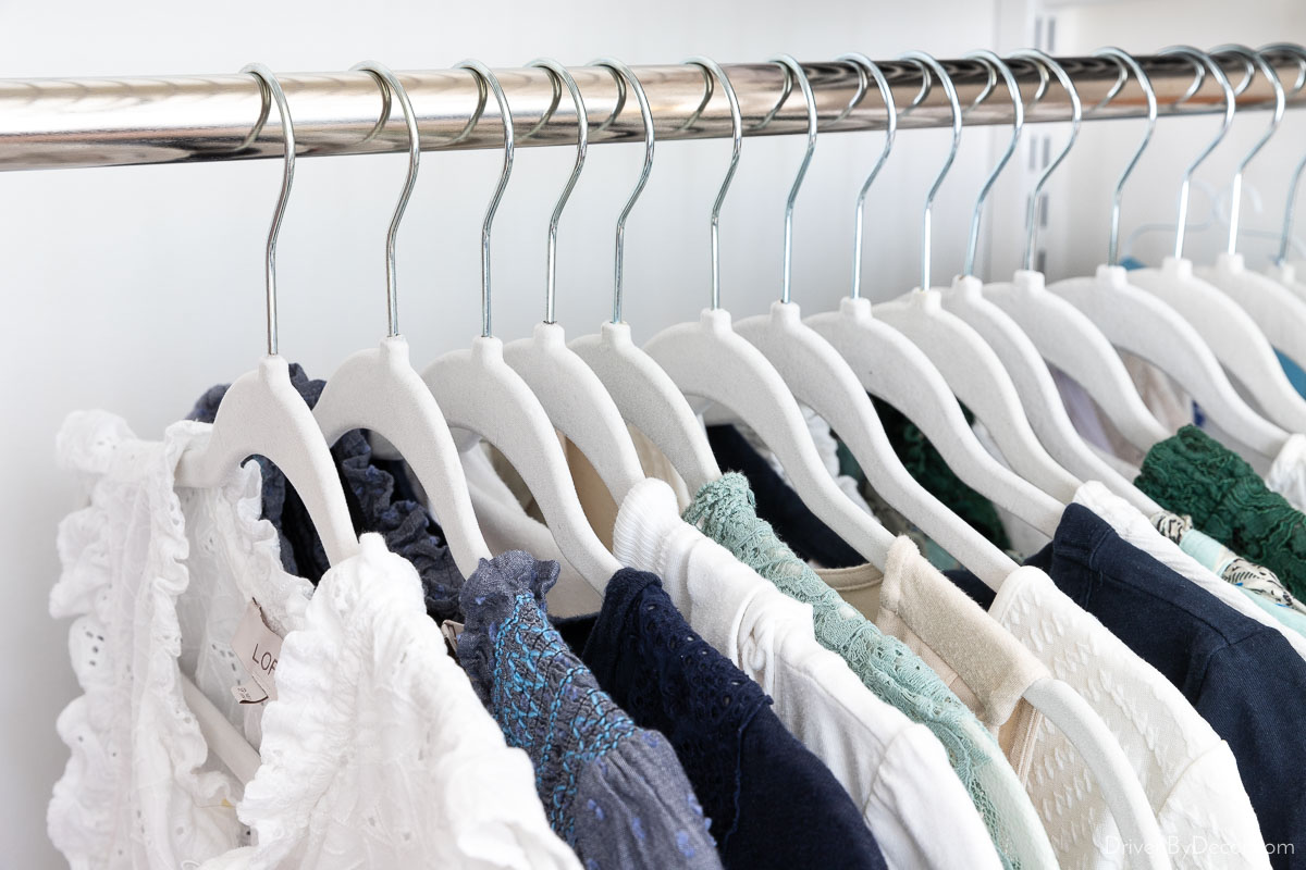 Matching velvet space-saving hangers in organized closet