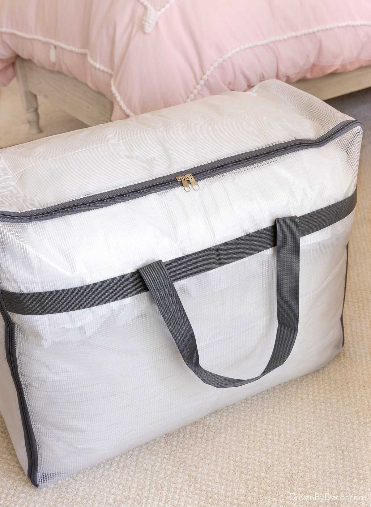 Storage bag with handles for storage of pillows and blankets in closet