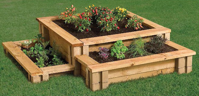 Inexpensive tiered raised garden bed made with planter wall blocks