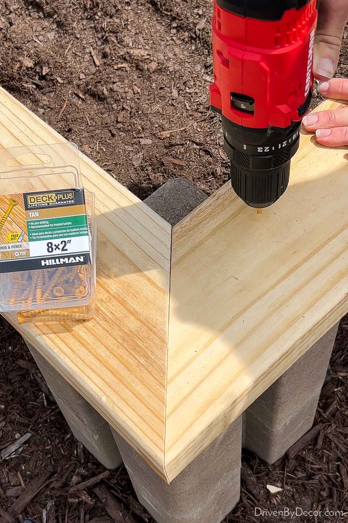 Screwing cap onto top of raised garden bed