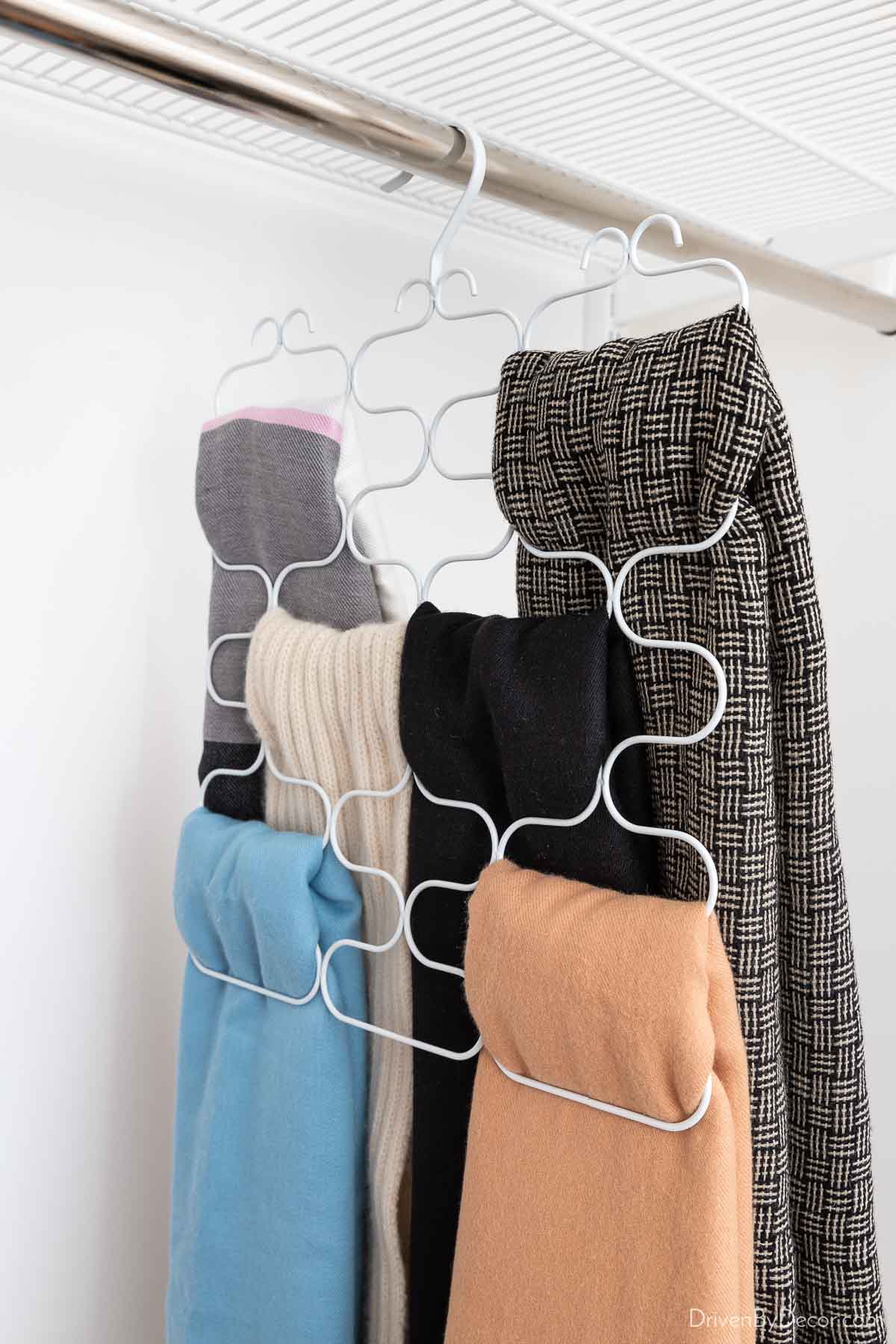 Closet organization of scarves using this multi-loop scarf holder with six scarves on it