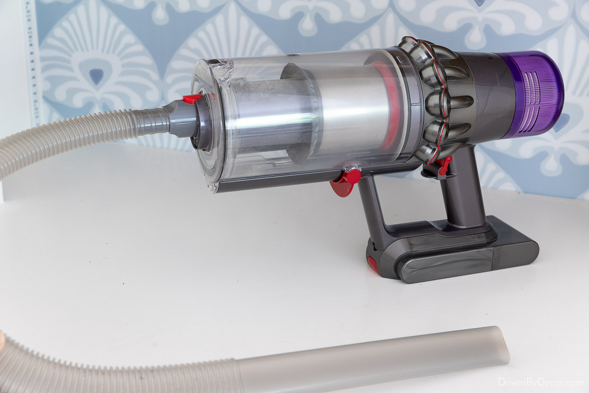 Dyson handheld vacuum with long attachment for cleaning hard to reach places