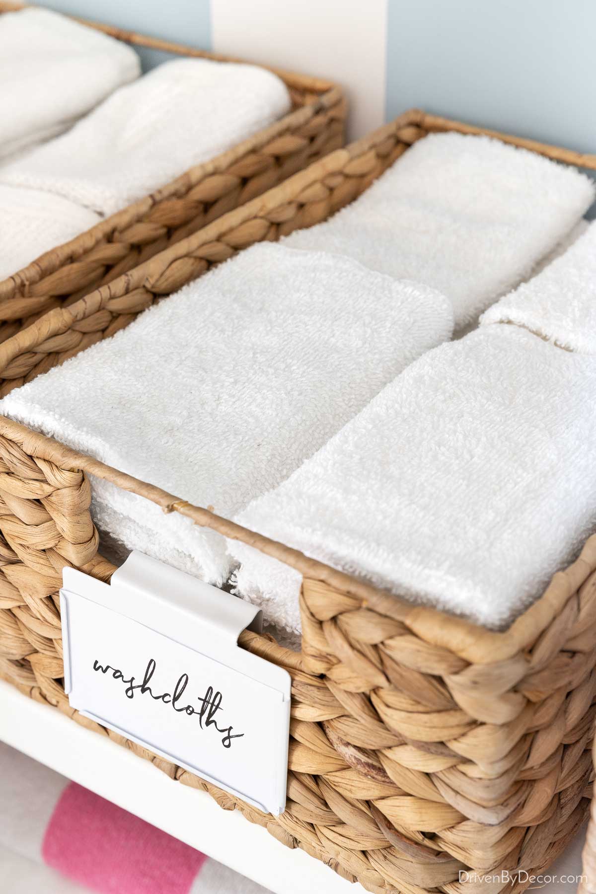 Washcloths organized in basket in linen closet