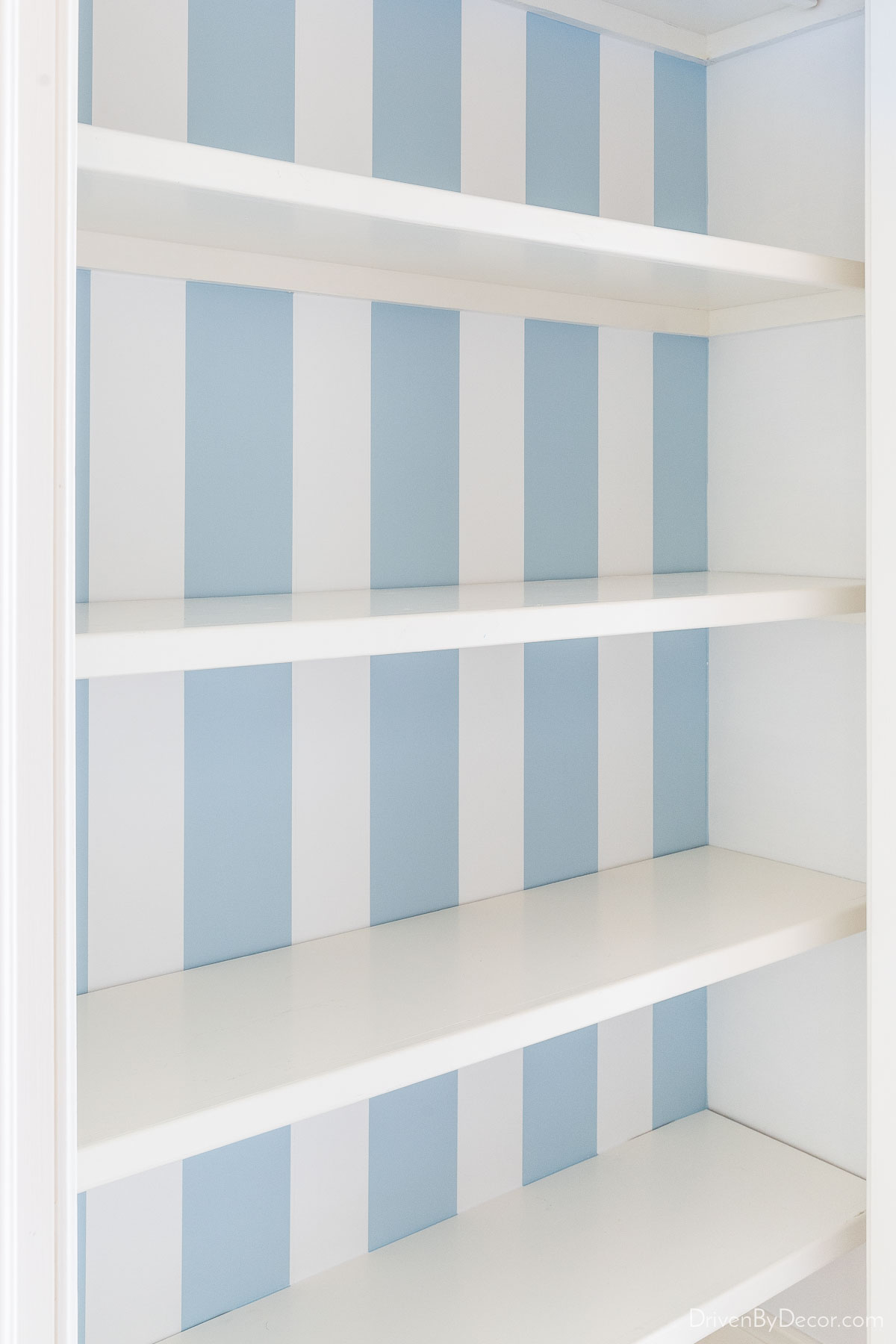 https://www.drivenbydecor.com/wp-content/uploads/2023/05/linen-closet-blue-stripe-wallpaper.jpg