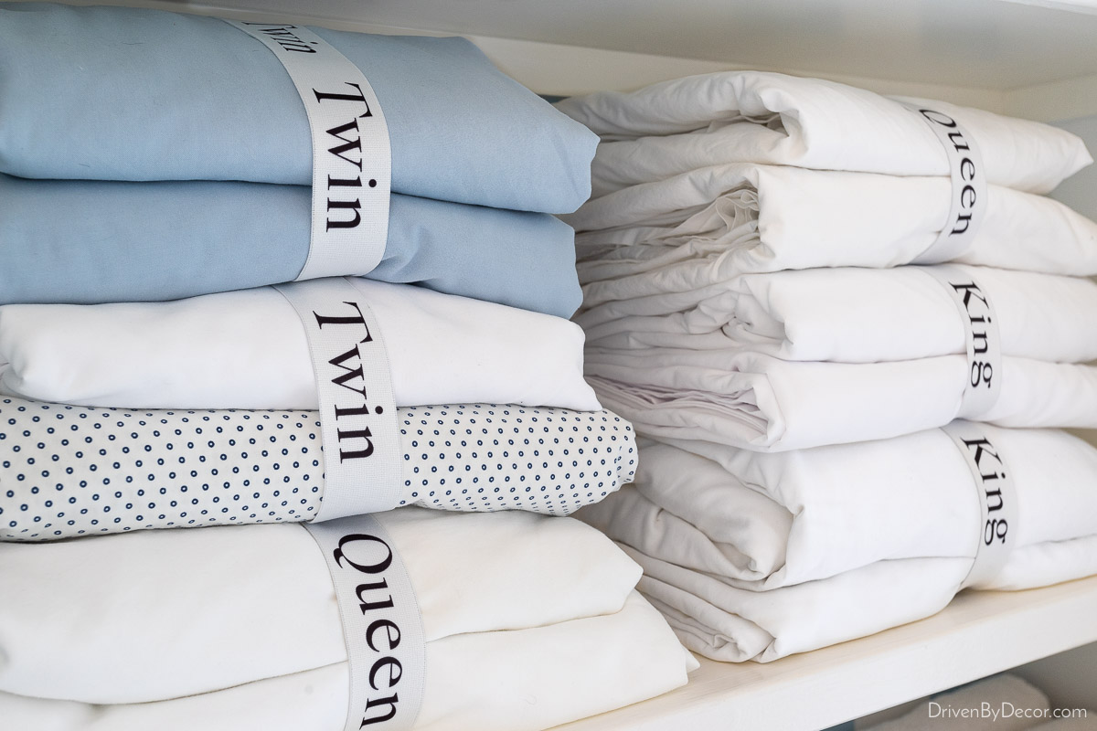 Sheets with labeled bands as a linen closet organization idea