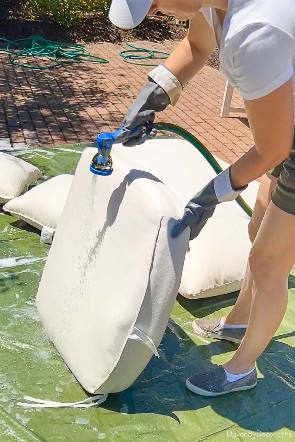 Rinsing cushion - one of the last steps in how to clean outdoor cushions