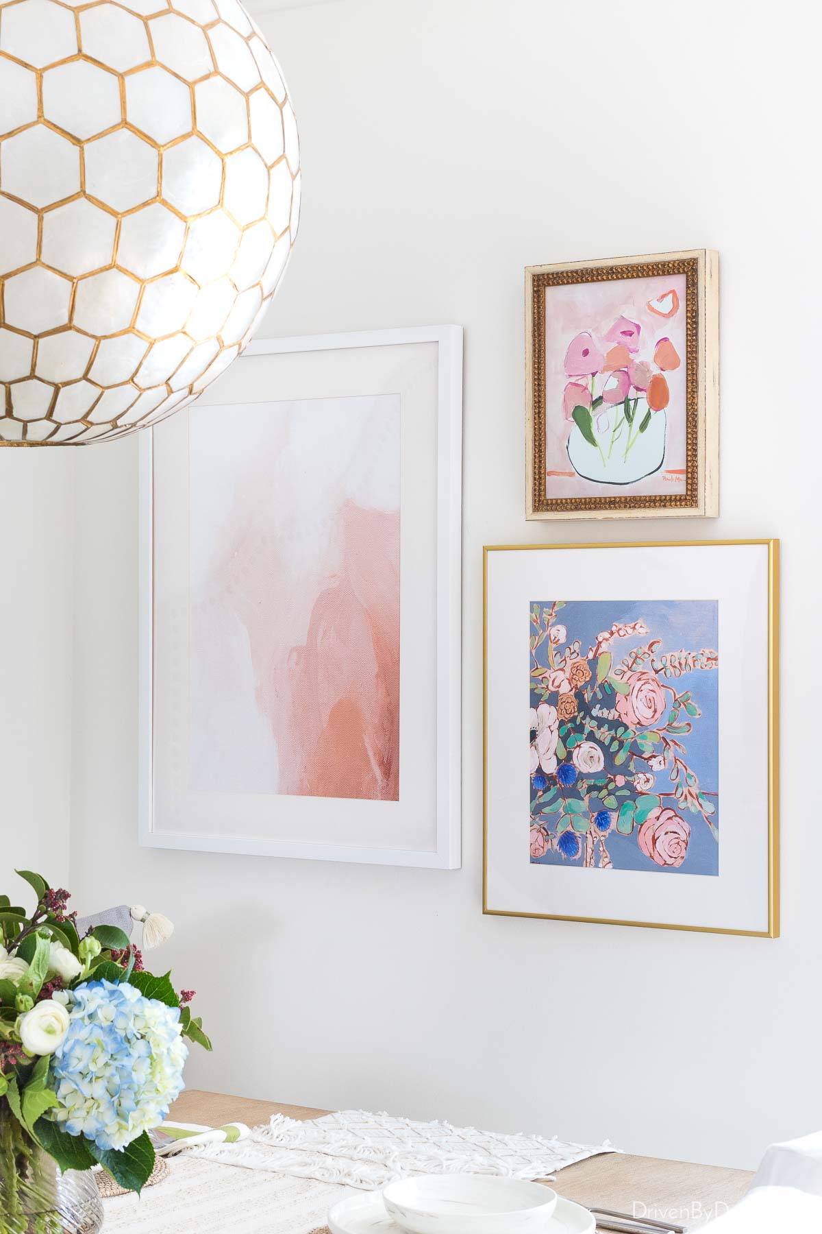 A trio of art pieces hung asymmetrically as a gallery wall 