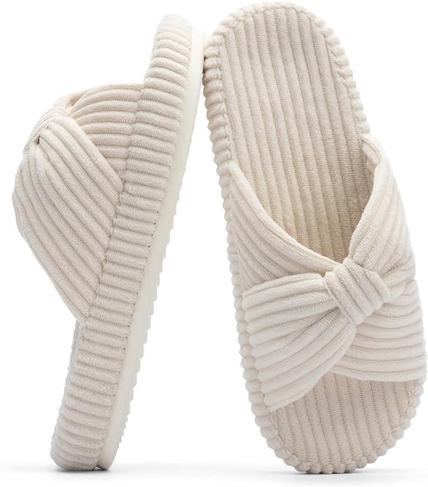 Pair of off white bow slippers
