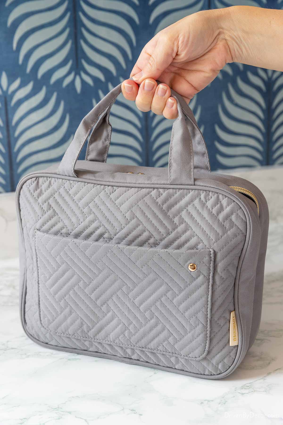 Folding travel toiletry bag with handles
