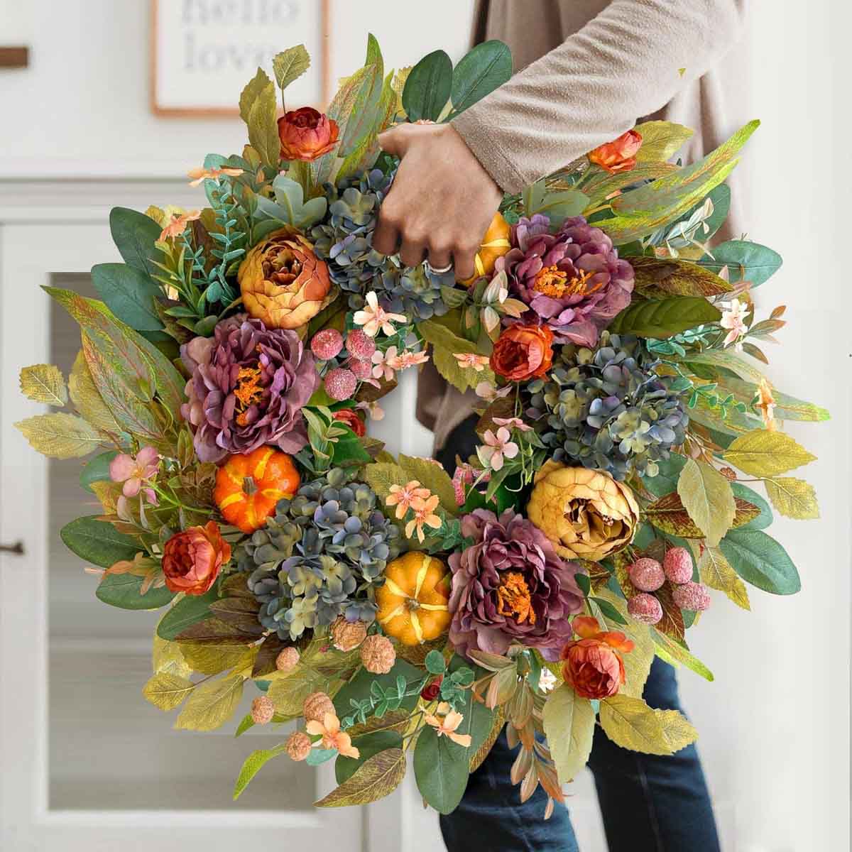 Budget friendly fall wreath with flowers and pumpkins