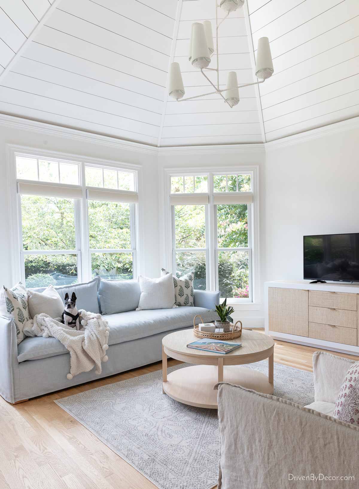 Our sunroom with round coffee table that's too small for the space