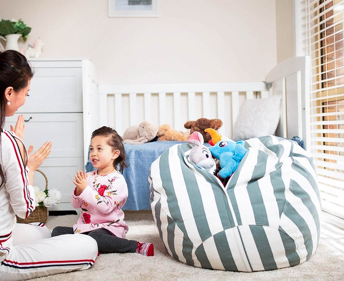 Stuffed animals placed in a bean bag cover for simple, functional bedroom storage