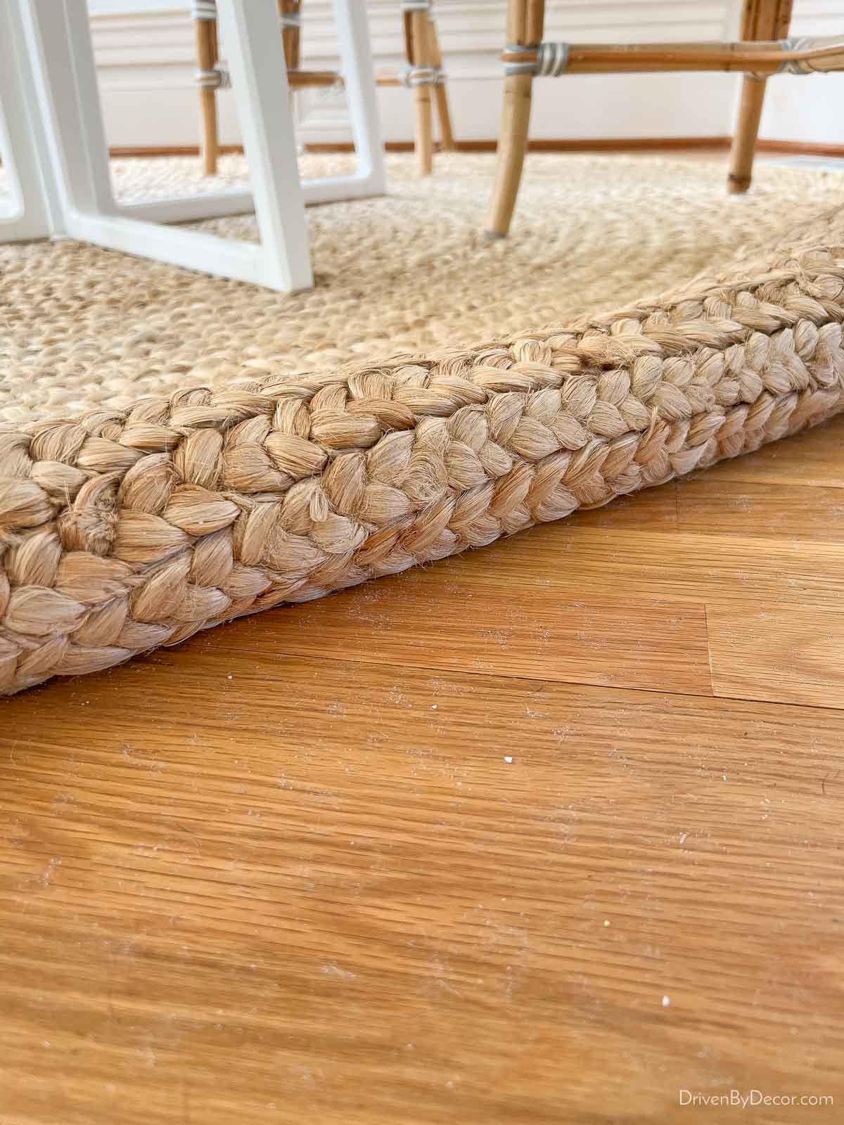 Debris that sheds from under a jute rug showing need for a rug pad