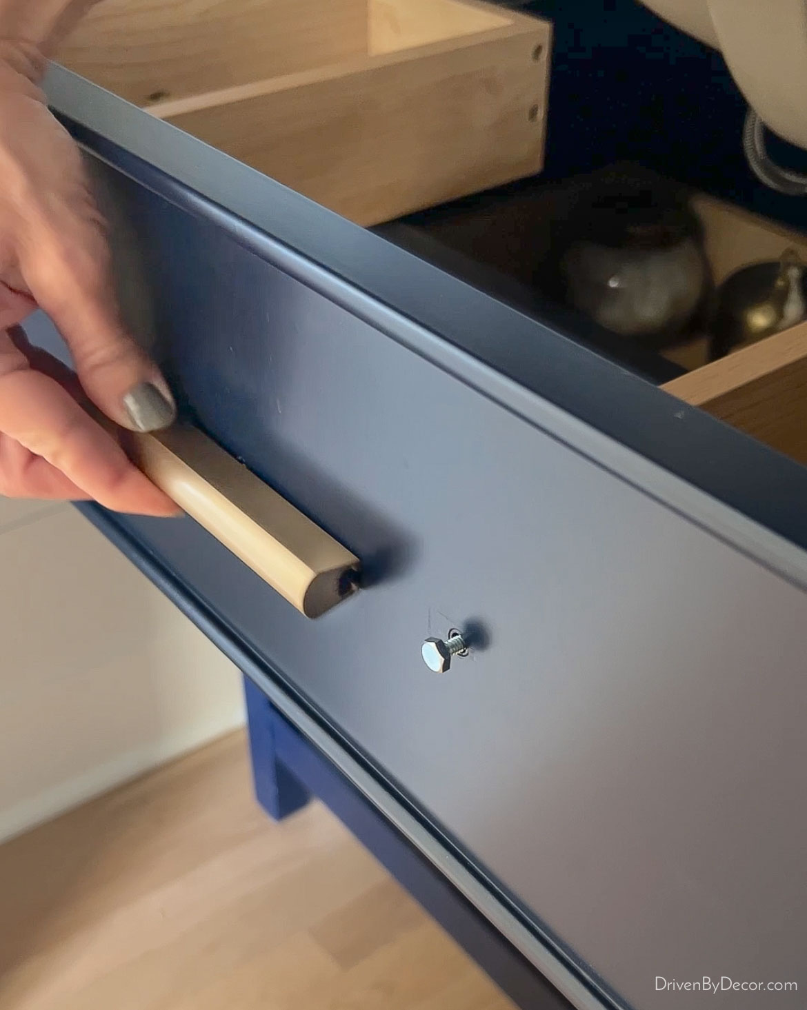 Sliding pulls over screw heads - the perfect solution for cabinet holes that are an odd size