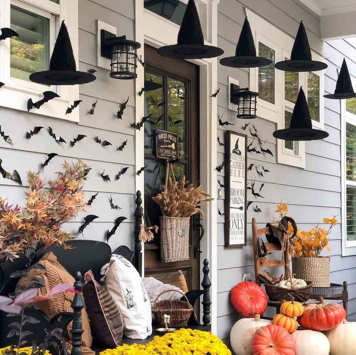 Front porch with bats and hanging witch hats