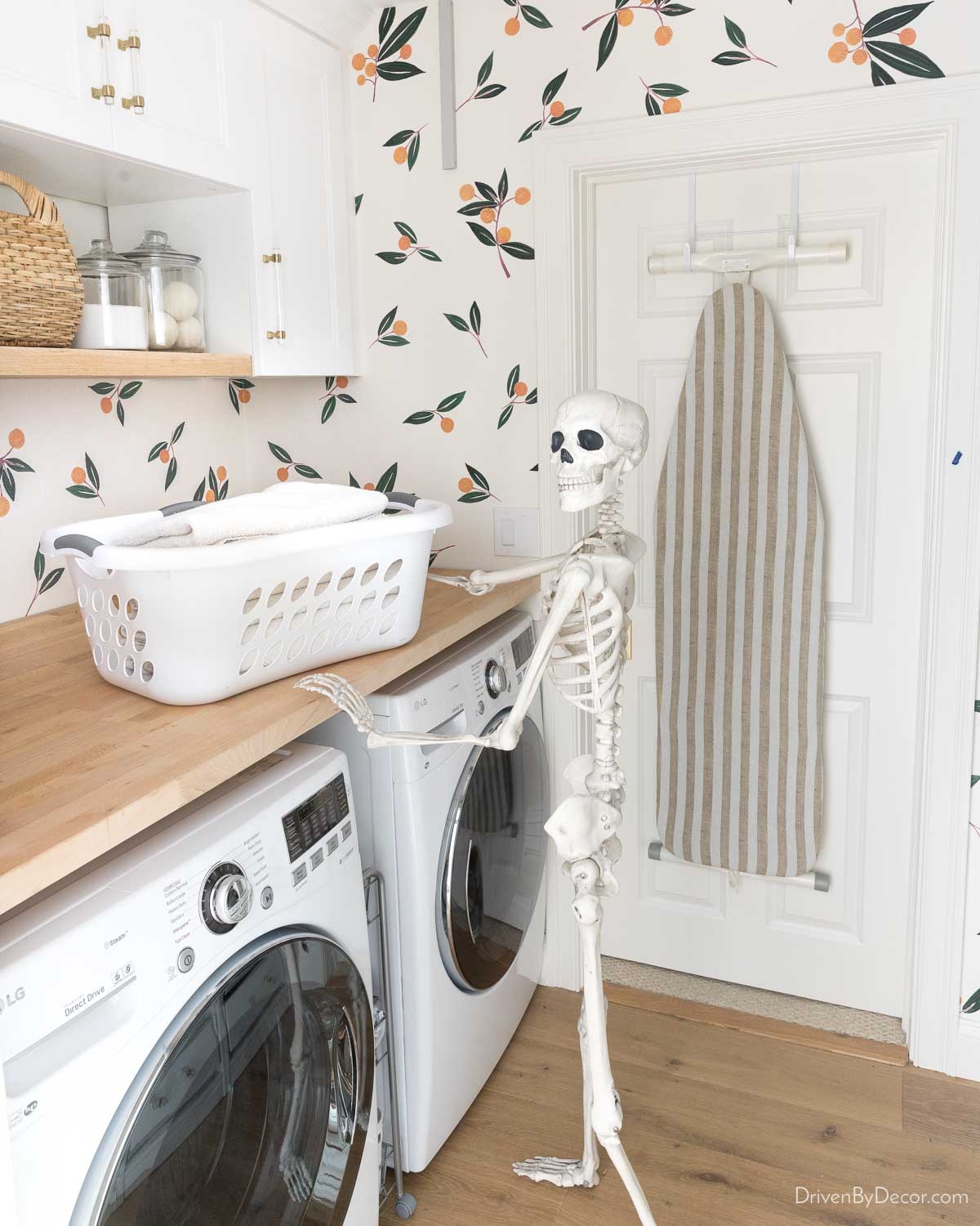 Posable skeleton in laundry room for Halloween