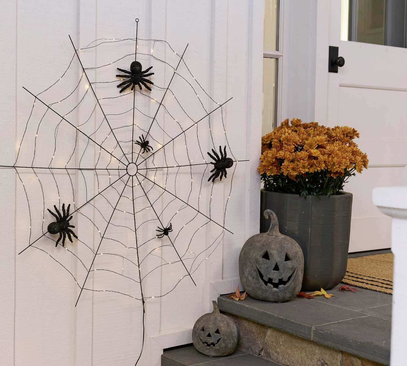 Lit spider web for front porch Halloween decor