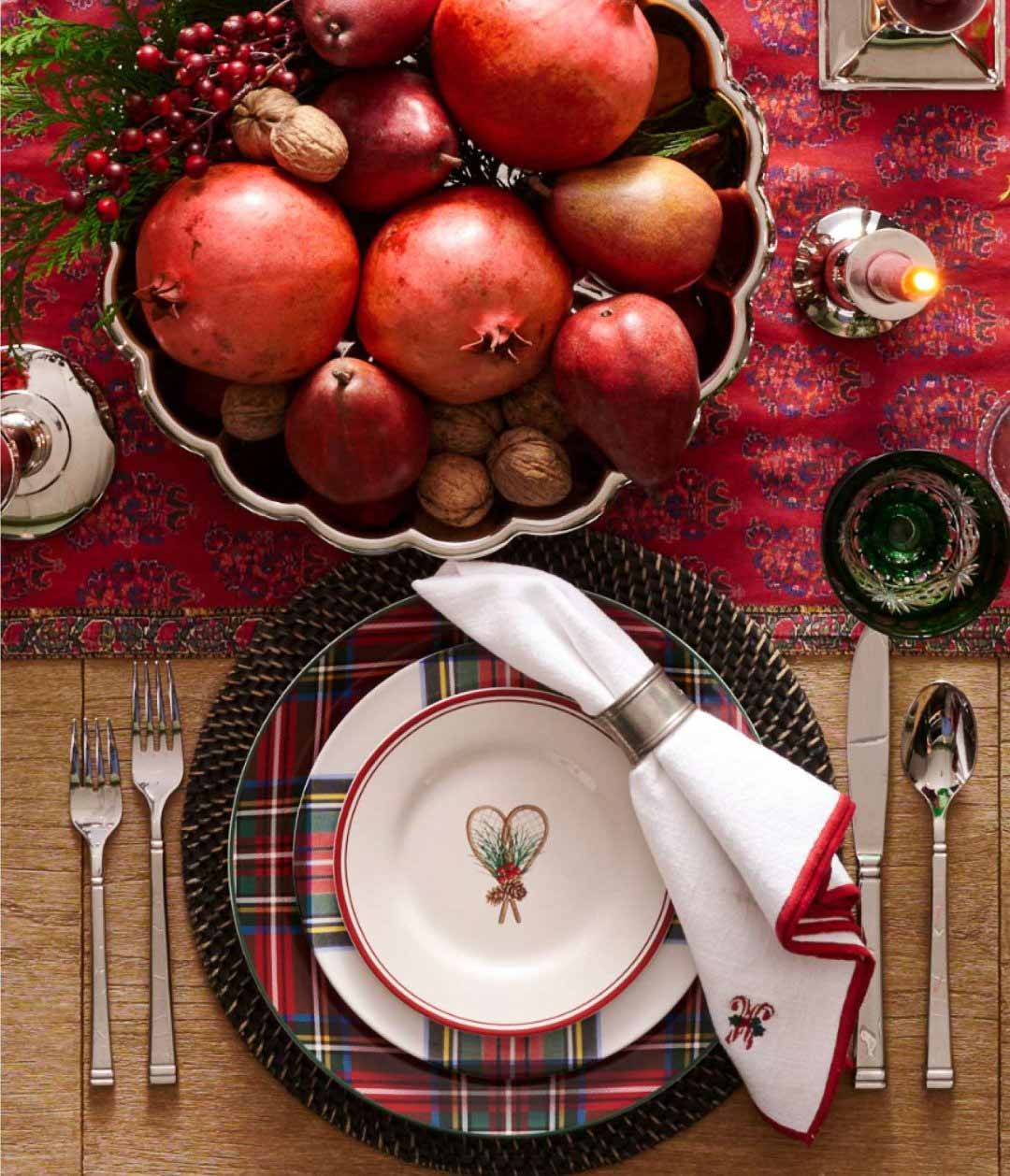 Christmas table decor with centerpiece of pomegranates and nuts