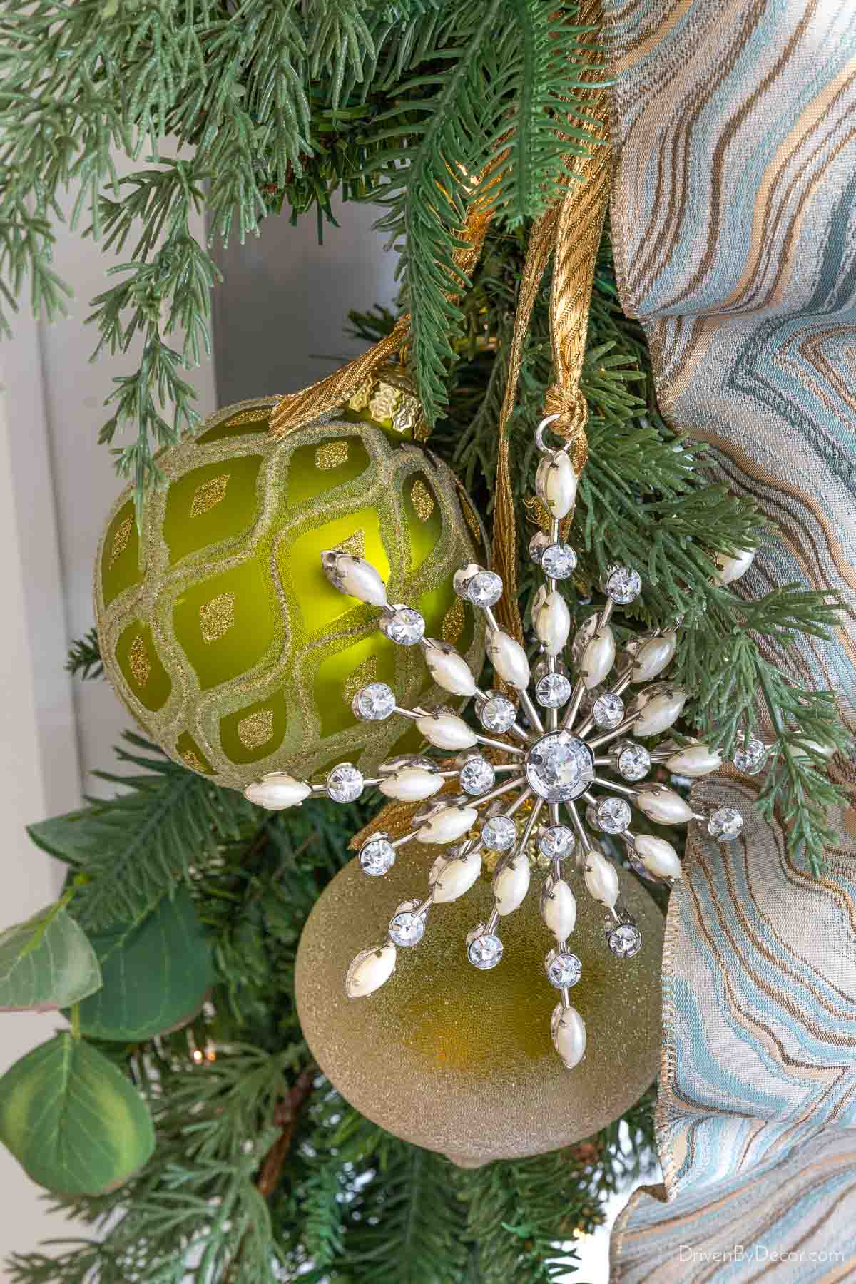 Snowflake and ball ornaments hung on garland