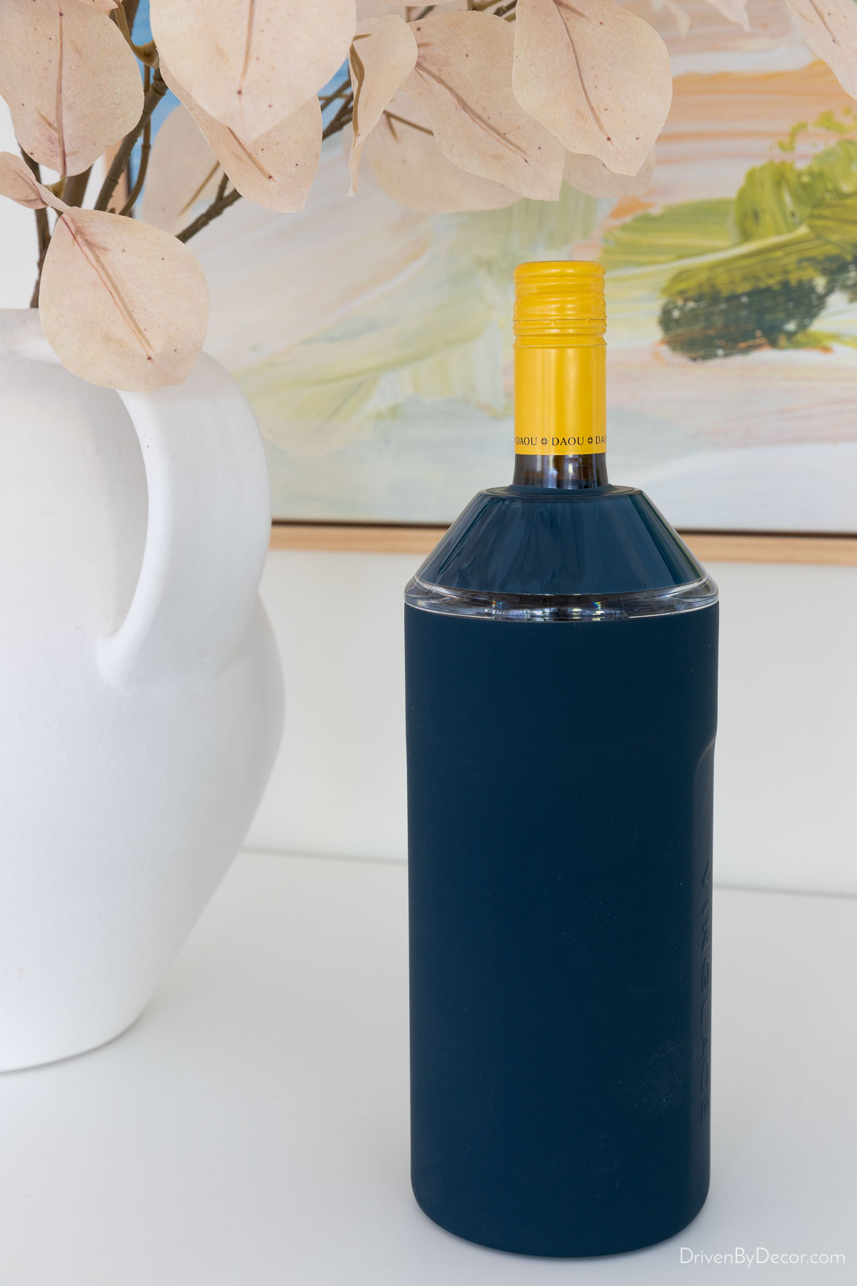 Navy blue wine chiller with bottle of wine
