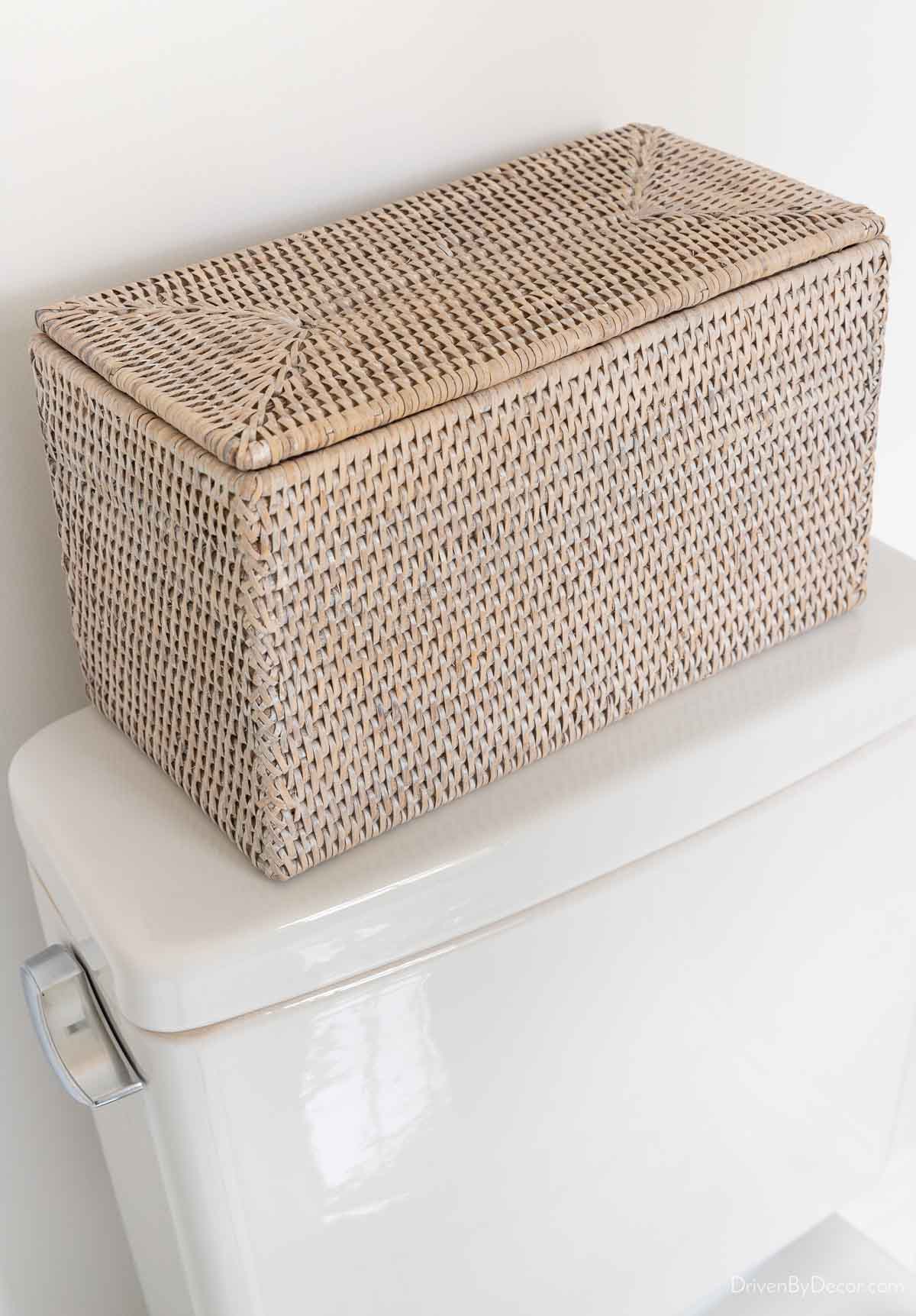 Woven storage box as toilet tank decor idea