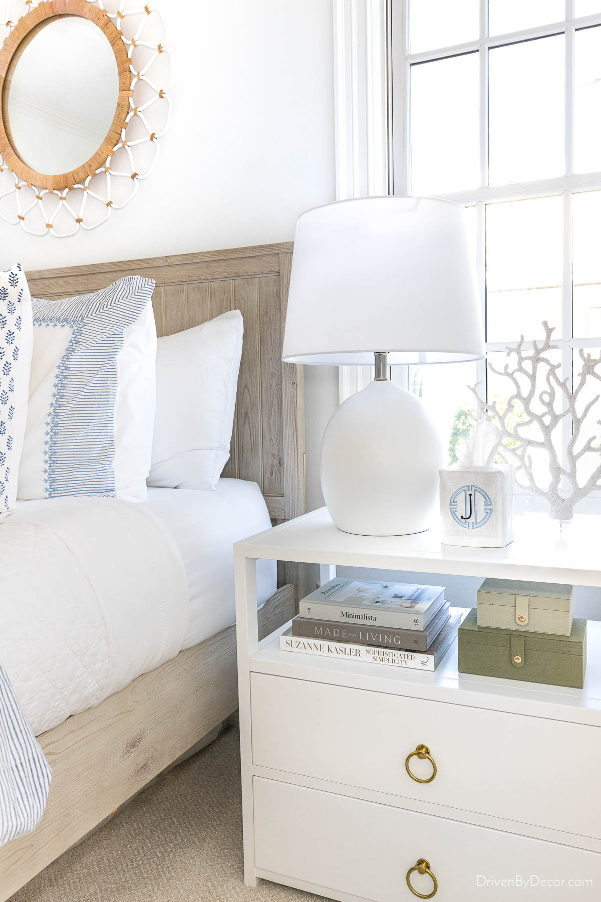 White concrete table lamp on white nightstand in bedroom