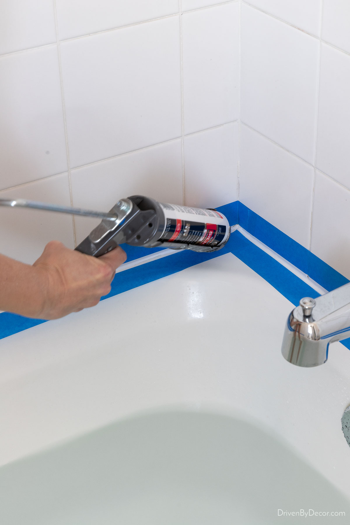 Caulking your bathtub with a caulk gun