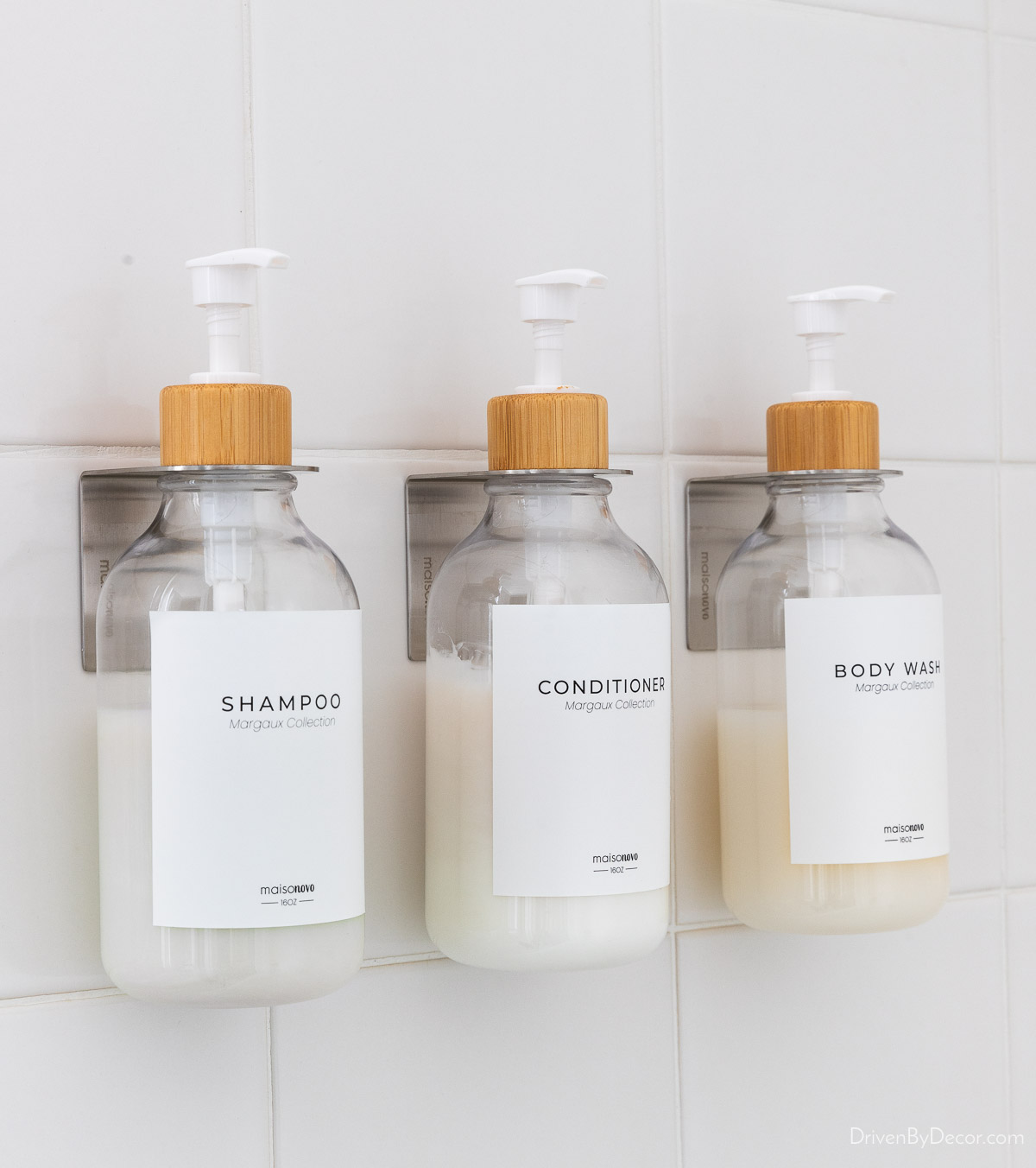 Shampoo, conditioner, and body wash pump bottles in shower