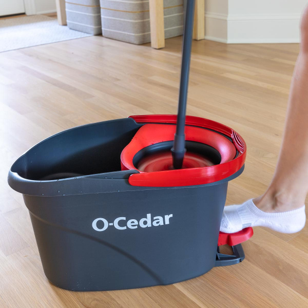 Pressing pedal on spin mop